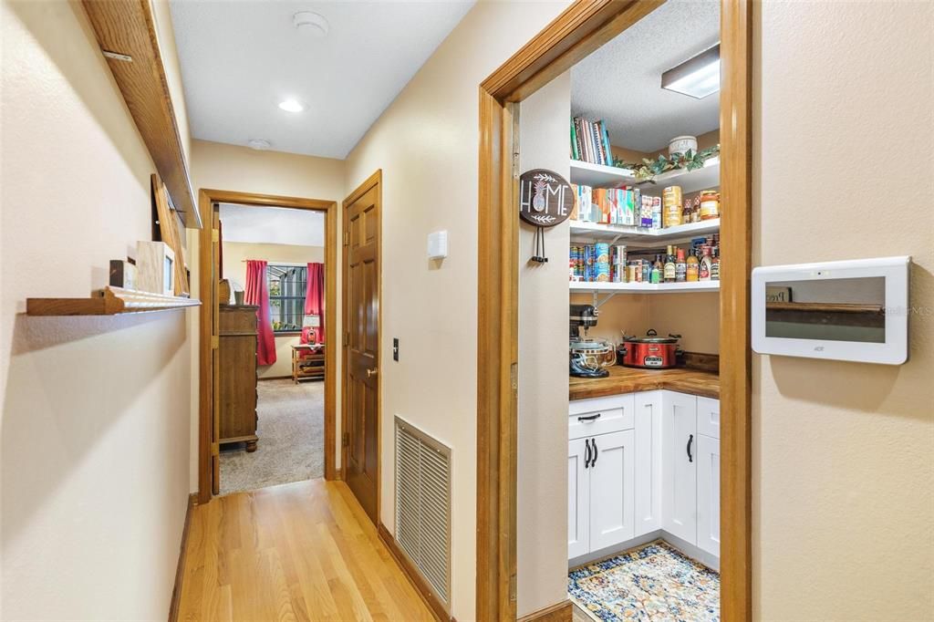 Hallway leading to Pantry and Primary Bedroom