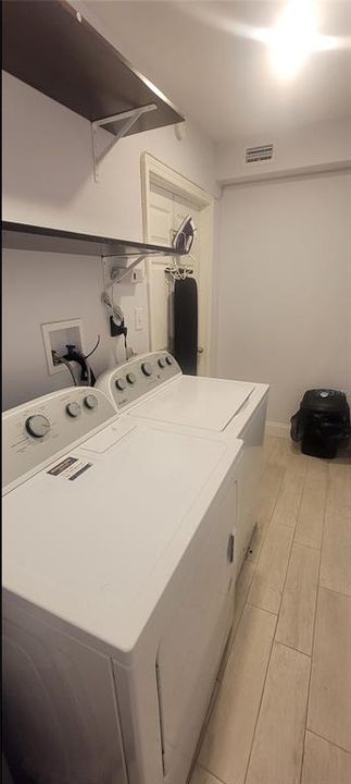 Laundry room w/shelves. Washer & dryer are INCLUDED