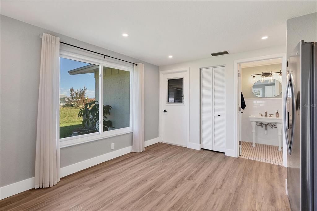 A convenient powder room is located adjacent to the kitchen.