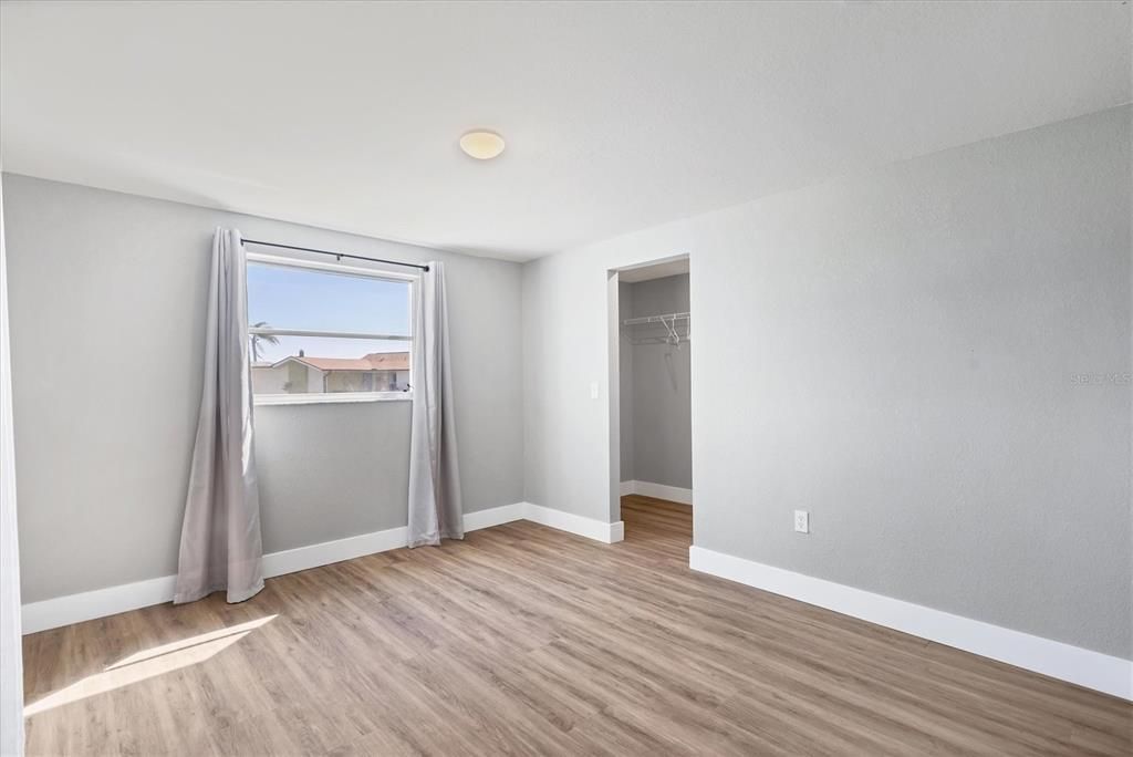 Guest bedrooms two and three offer walk-in closets and new LVT flooring.