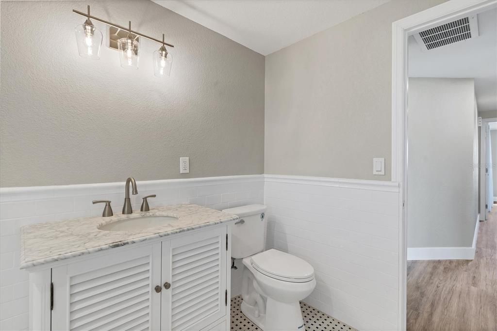 The guest bath has been remodeled to include a tub/shower combination accentuated with on-trend subway tile.