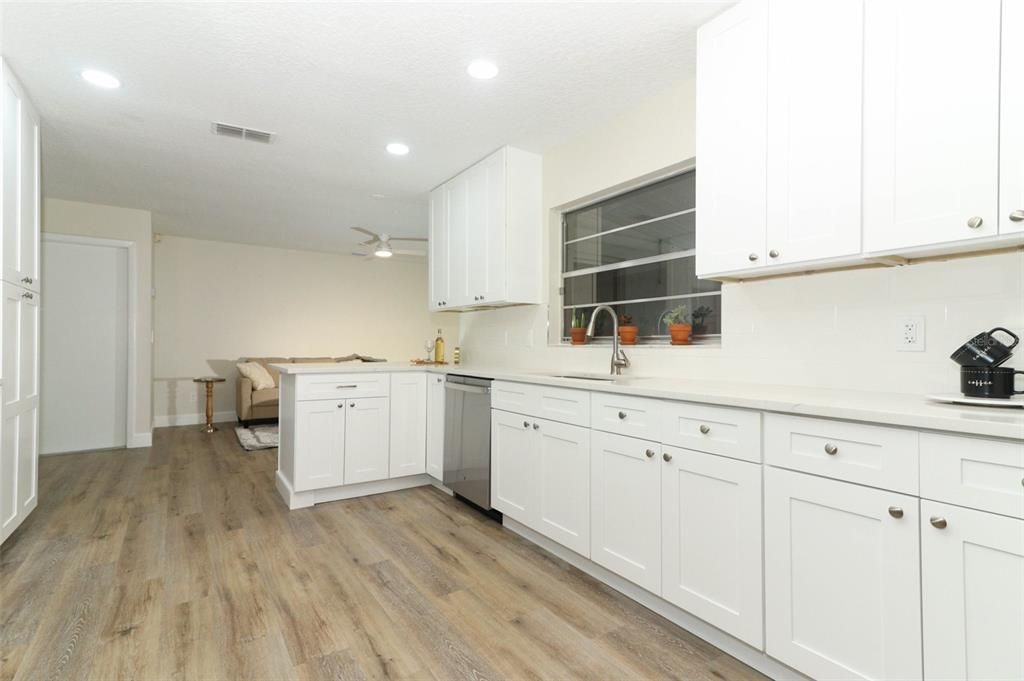 White Wood Soft Close cabinets with tile backsplash