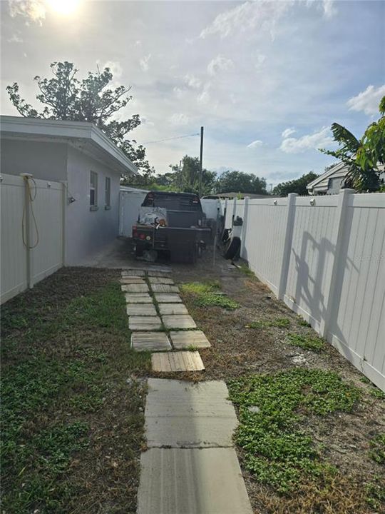 Private fenced gated entry to studio apartment. Separate parking pad for studio.