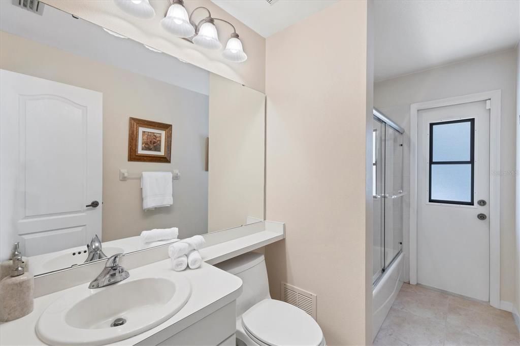 Guest Bathroom with Door to Lanai