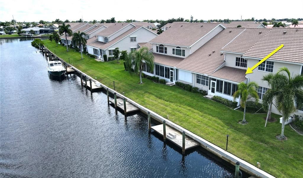 Aerial view of home's waterfront and dockage