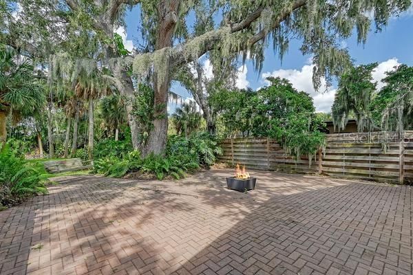 Over 2000 sq. ft. open brick patio off pool cage.