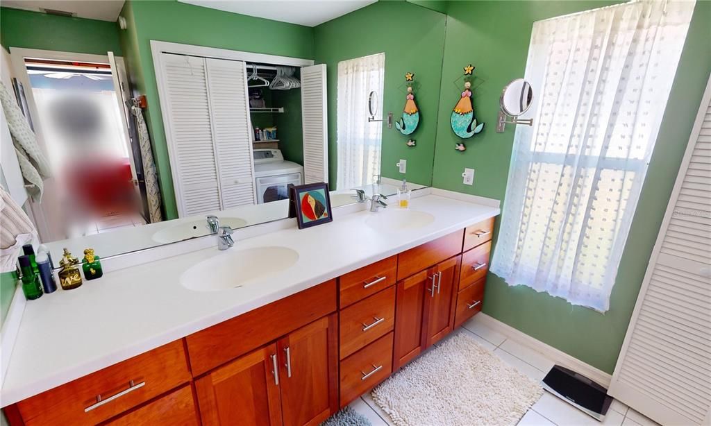 Primary bedroom with washer & Dryer