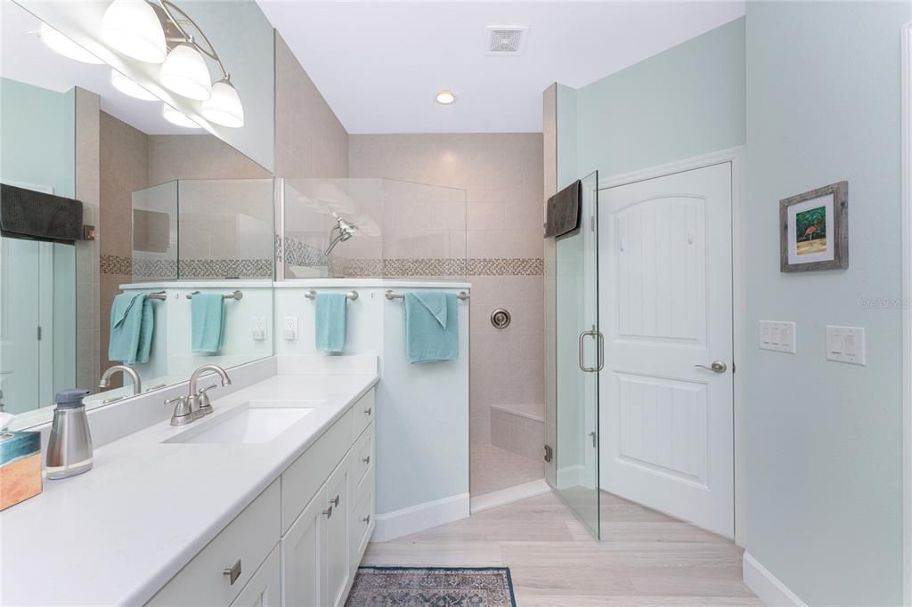 All-Tiled step-in shower with a beautiful glass enclosure