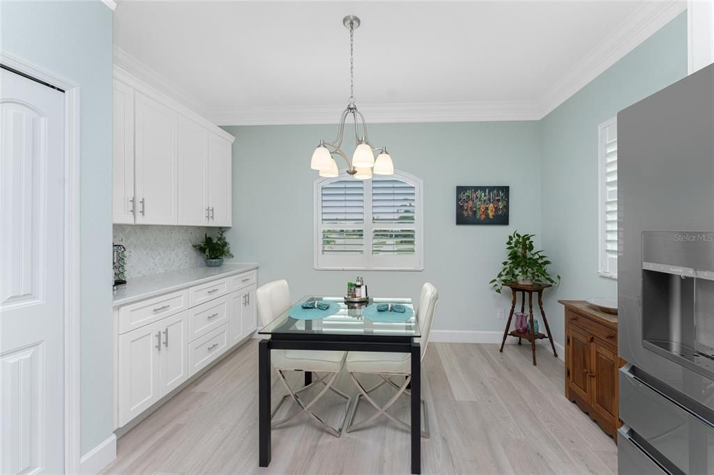 Breakfast nook located off the kitchen has additional storage space and a perfect spot for your coffee bar