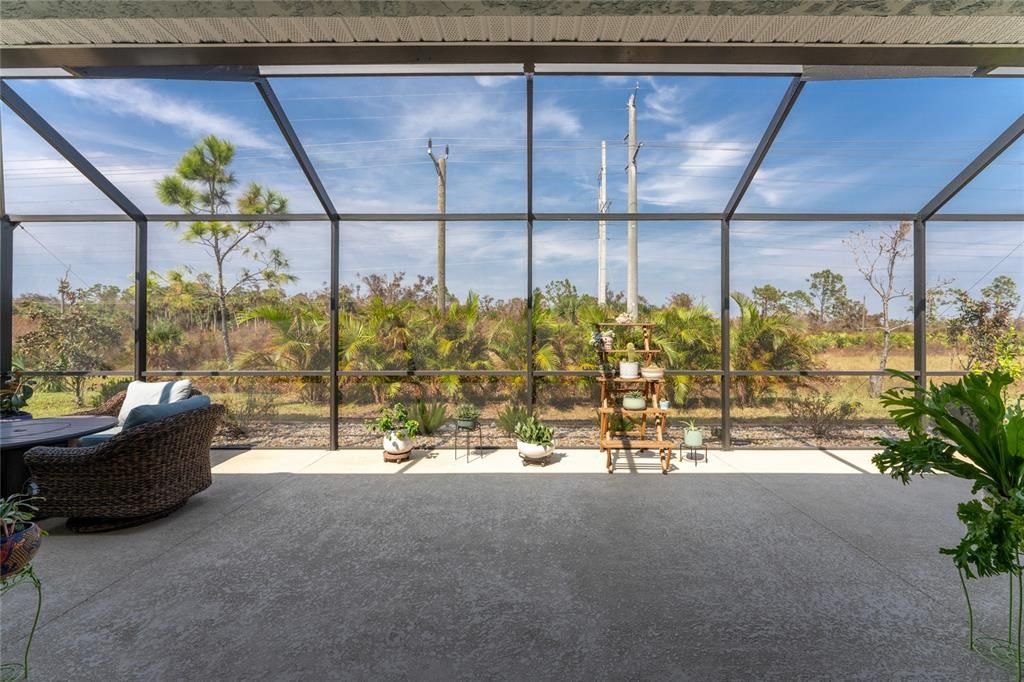 Extended screened Lanai expands your outdoor living space and offers panoramic nature views