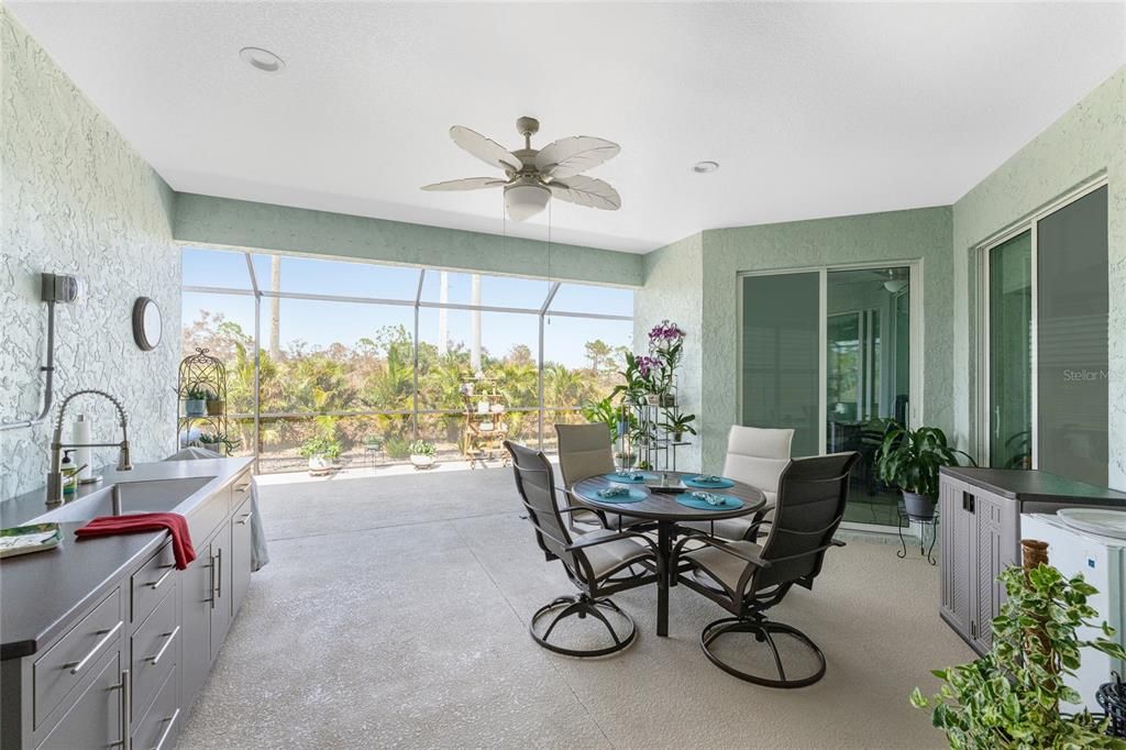 Outdoor living space with kitchen setup and room for fresh-air dining