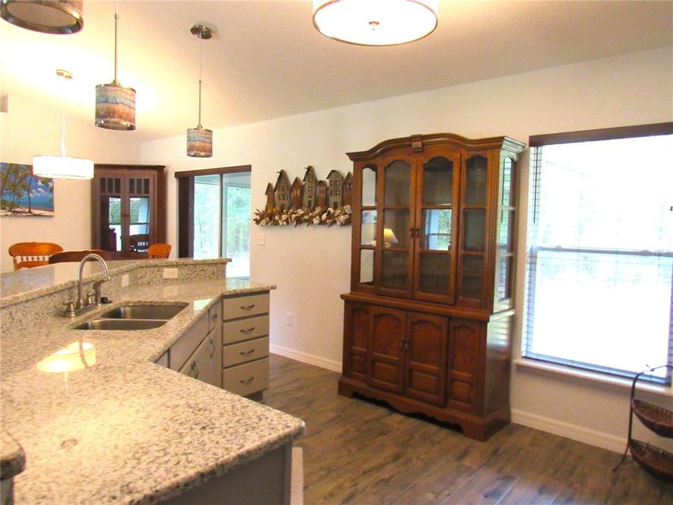 Beautiful Gourmet Kitchen w/ Cathedral Ceiling & Porcelain Tile Floor + Large Viewing Window.