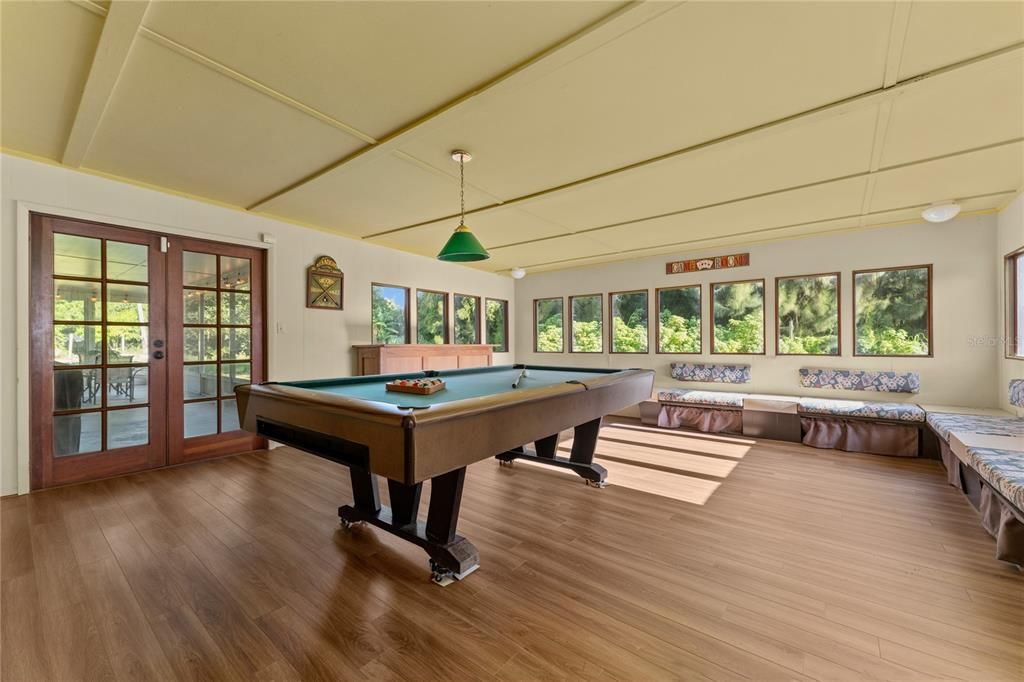 Florida room with French doors leading to the enclosed patio.