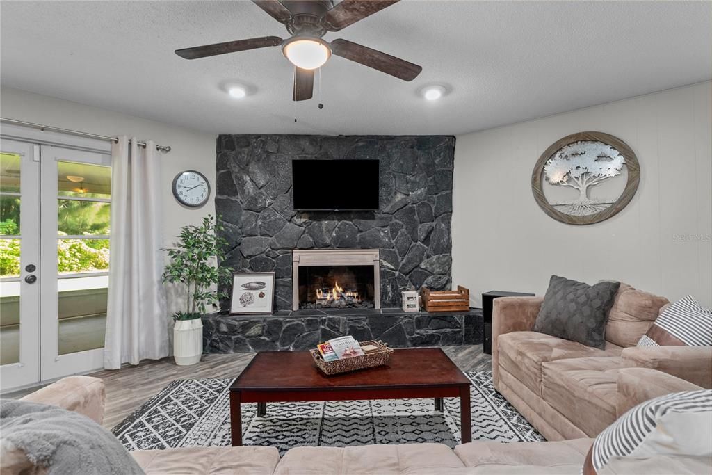 Family room with French doors leading to the enclosed patio