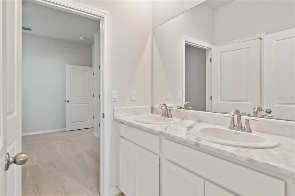 Jack and Jill Bath with dual sinks, granite countertops, and private Bath/Shower/ water closet