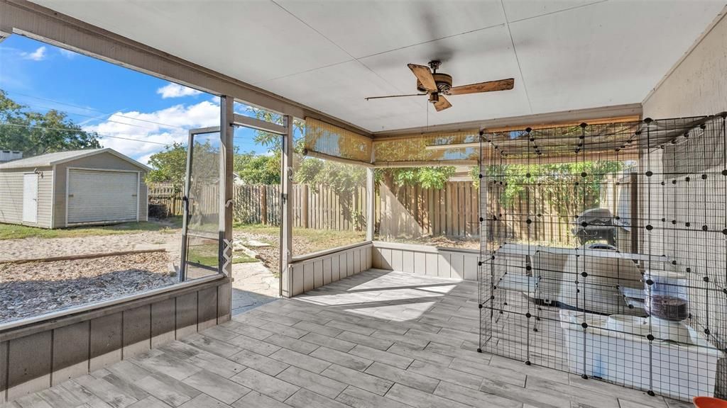 Screened in Porch with tile flooring