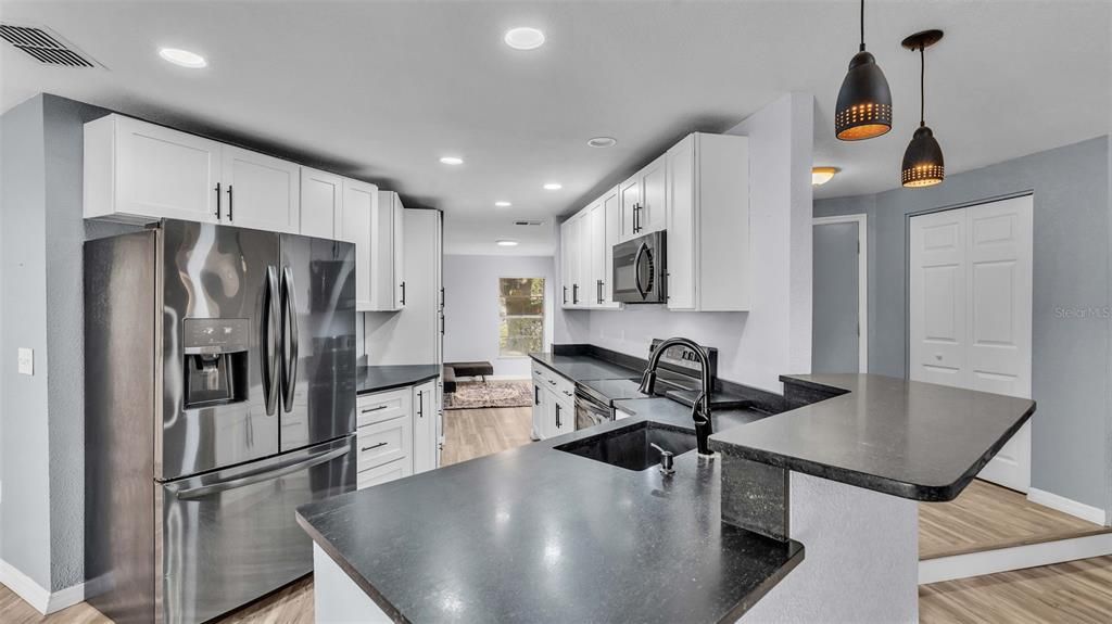 Kitchen View with view into Formal Dining Room or can be used as a den