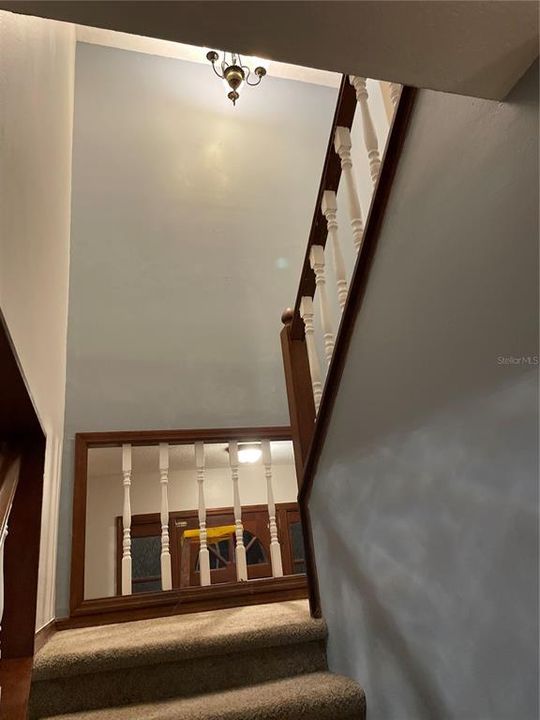 Stairs leading upstairs to 3bedrm and 2 bath