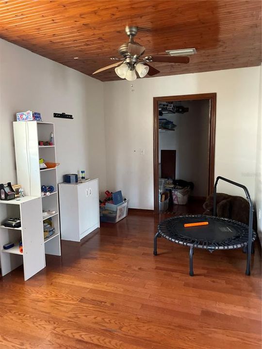 The other side of bonus room showing big walk-in closet space.