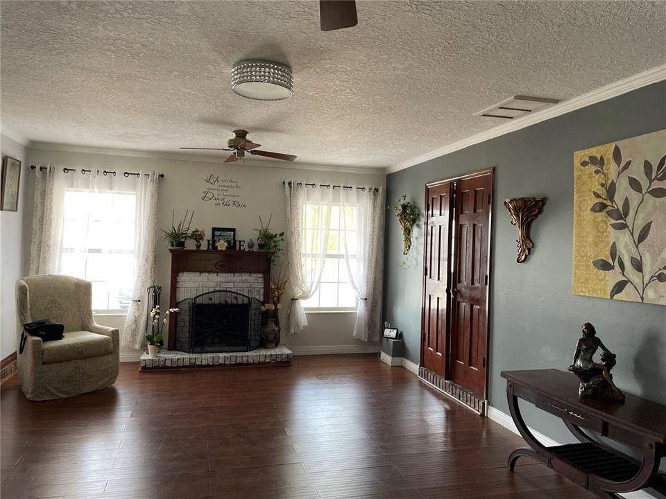 Livingroom with door to bonus room and half bath