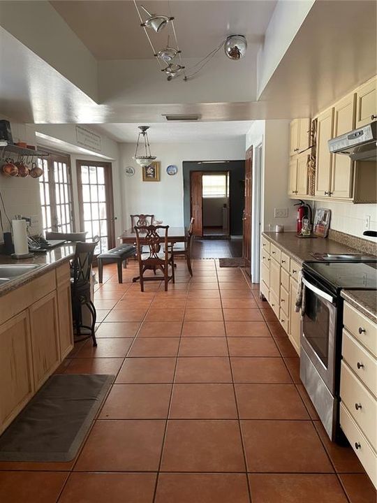 kitchen with counter space eating area that fits 2 chairs