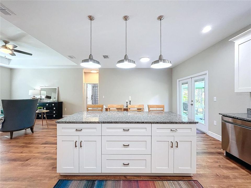 The kitchen island is loaded with draw and stoarge space.