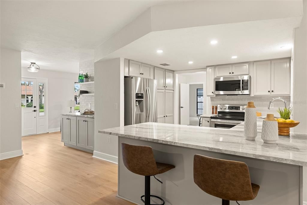 Kitchen with Granite Countertops and built in cabinet pantry storage