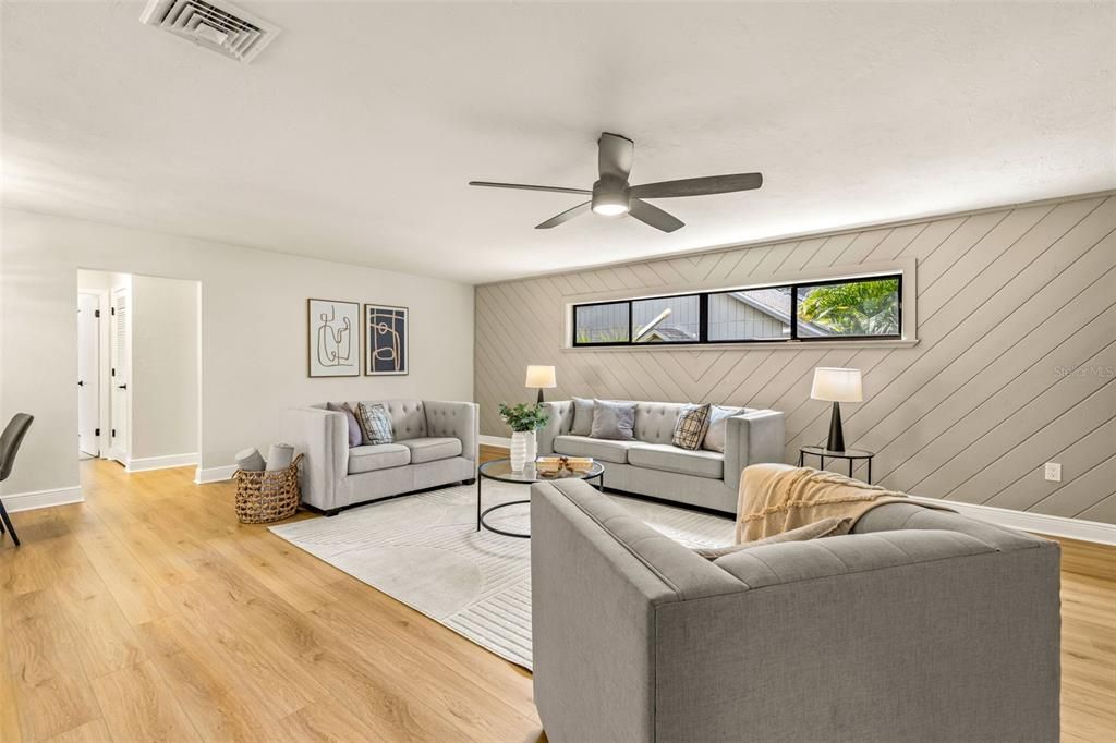 Large second living room showcasing shiplap style