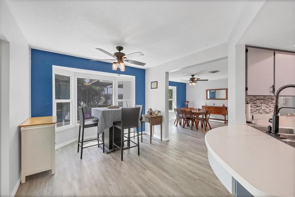 Breakfast nook and dining room beside kitchen