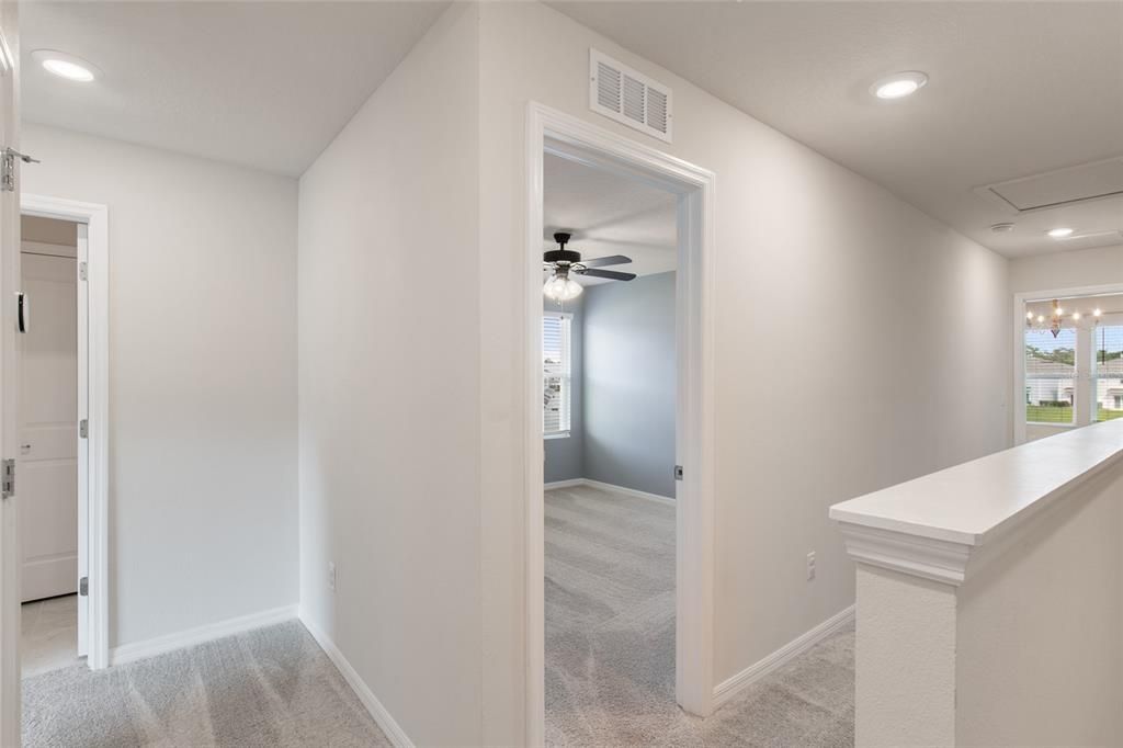 Top of Stairs leading to the three bedrooms, bathrooms and laundry closet