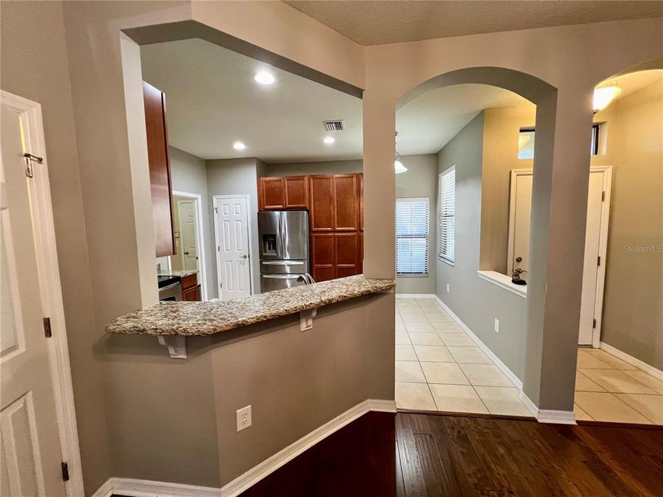 Comfortable breakfast bar leading to living room