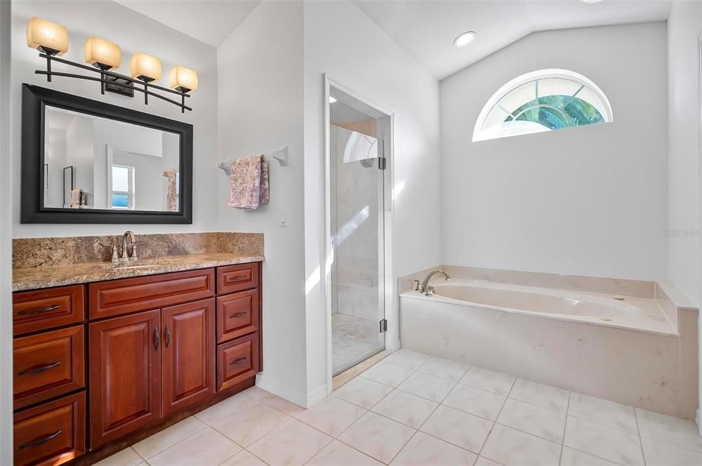 Primary bathroom w double vanities and 2 linen closets