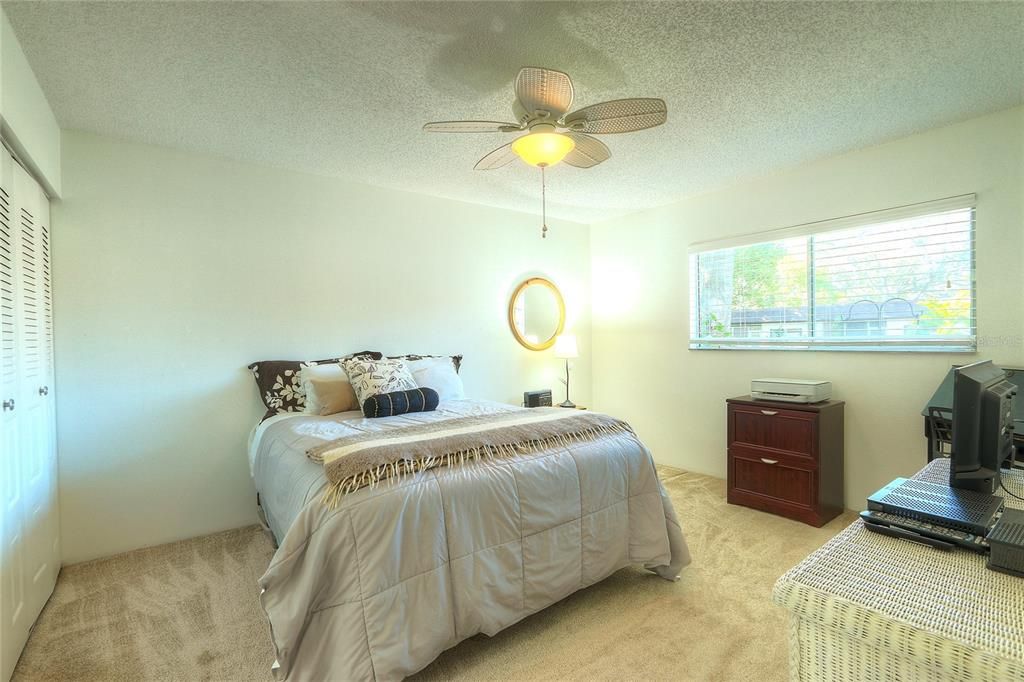 Large sunny bedroom with light flowing in from the beautiful courtyard!