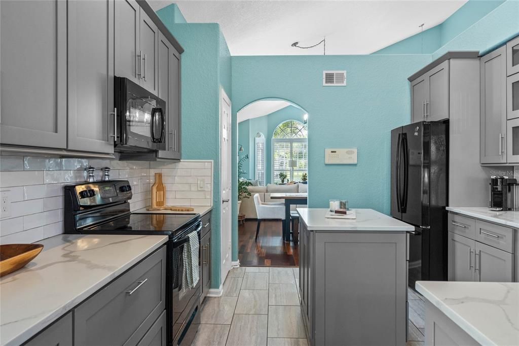 View into the kitchen looking toward the front of the home.