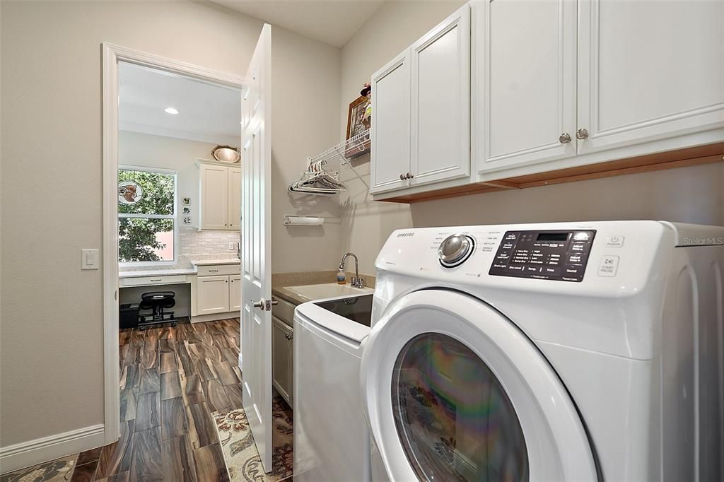 The washer and dryer convey with the home, there is ample cabinet storage plus a storage closet in the laundry room