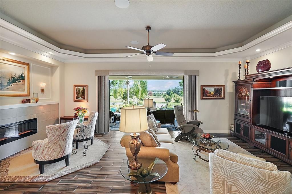 The family room and fireplace vinette have access to the lanai through the triple sliding doors.