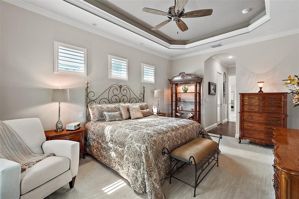 Soft segmented (eyebrow) arches framing the hallways and doorways featured in this home add to the overall elegance.