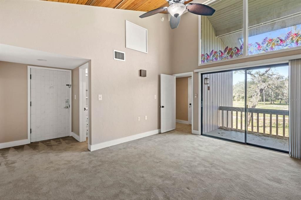 bedroom two with exterior entrance and balcony