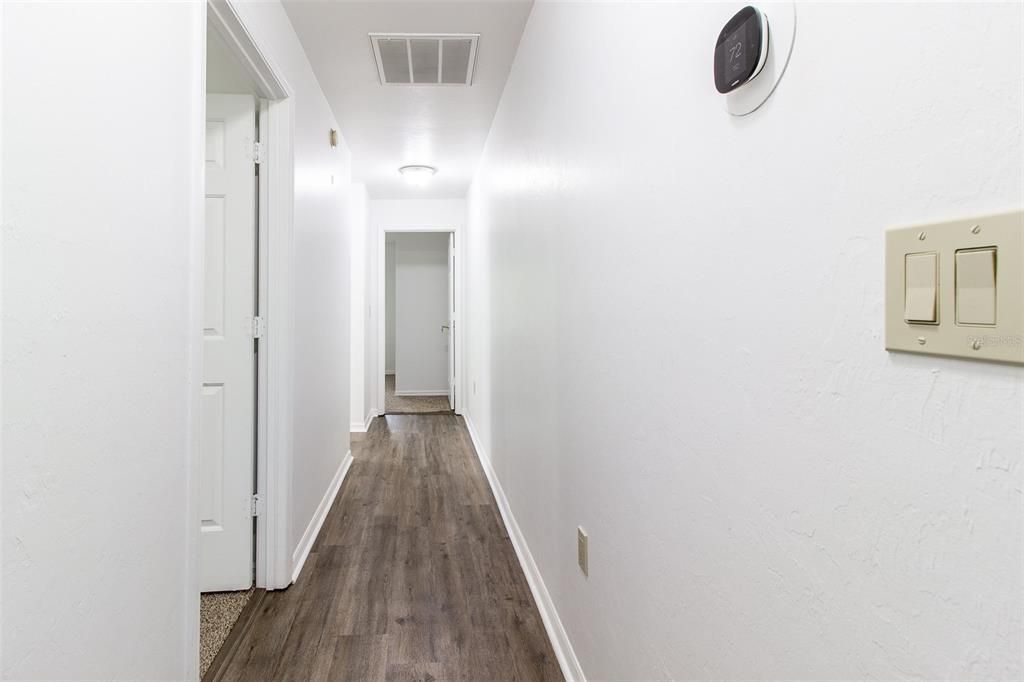 Hallway to two guest bedrooms and bathroom