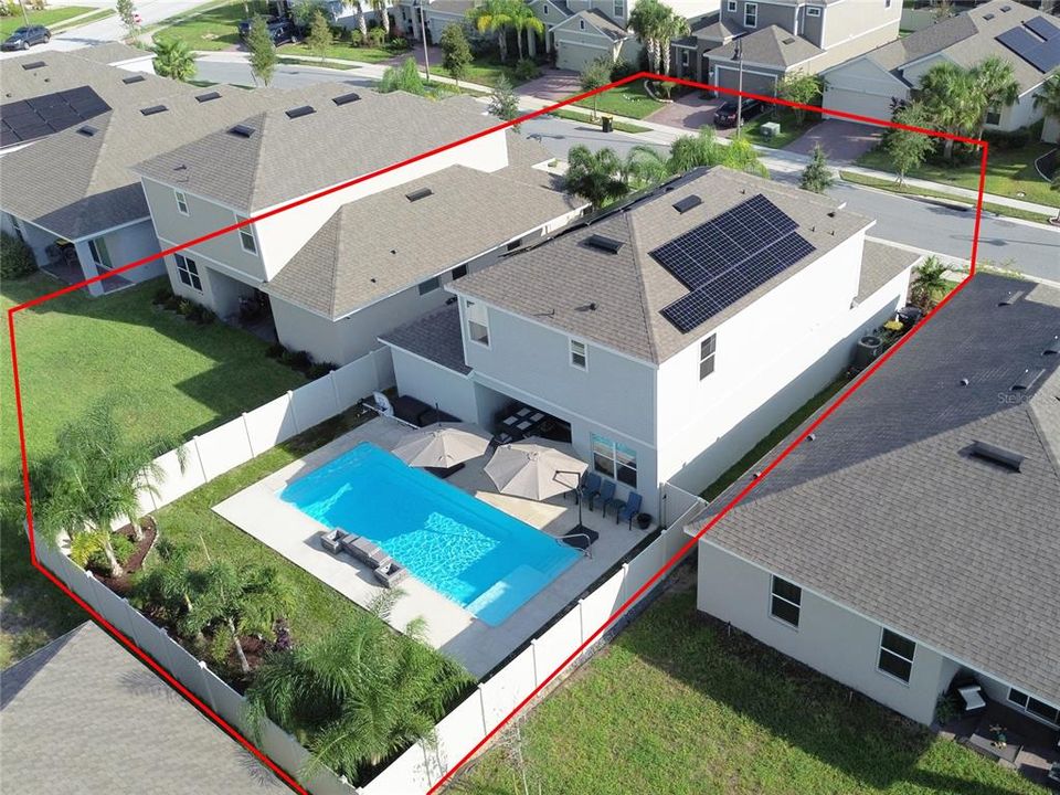 Aerial of Solar Panels and Fenced Heated Pool