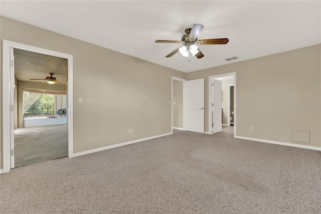 Primary Bedroom w Doorway to Patio