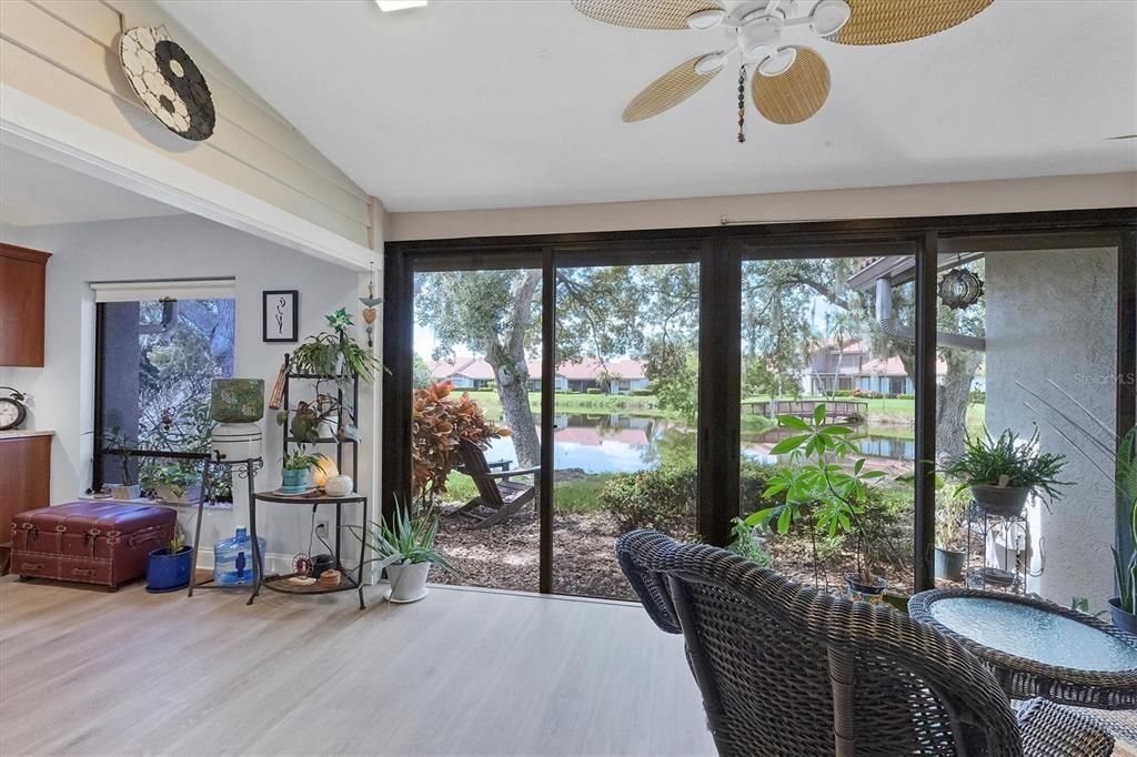 View of lake from sitting area with impact sliders and hurricane roller shades