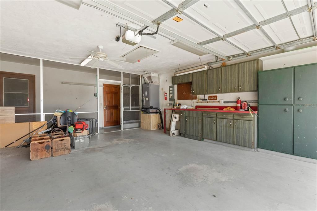 Huge Garage with Built in Cabinets and Work Bench