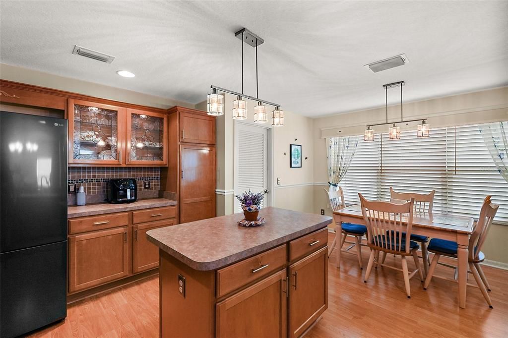 Custom glass leaded doors and lighting on cabinets.