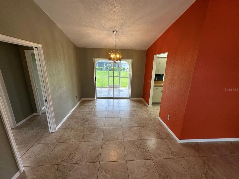 Dining area.  Kitchen entry on the right, guest bedrooms on the right.