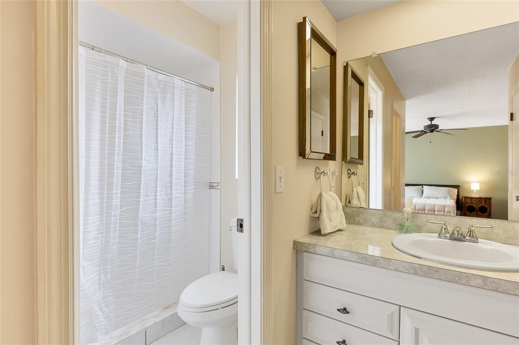 Master bathroom has separate area for the shower and toilet.