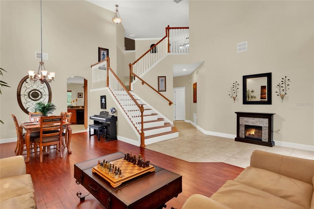 Living Dining Combo Showing Stairs up to Loft