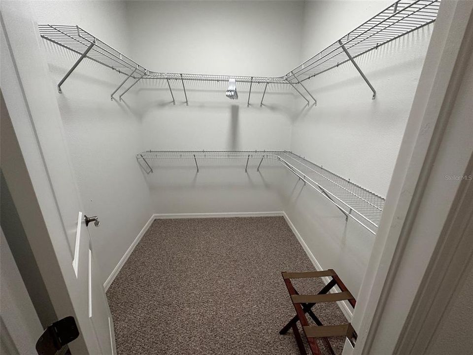 Primary bedroom walk-in closet.