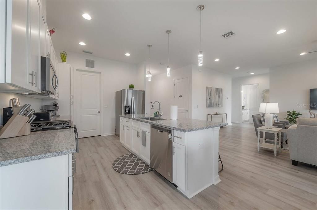 Kitchen Area with Modern design with vaulted ceilings and open floorplan. Gourmet Chefs' kitchen with new appliances and gas stove.