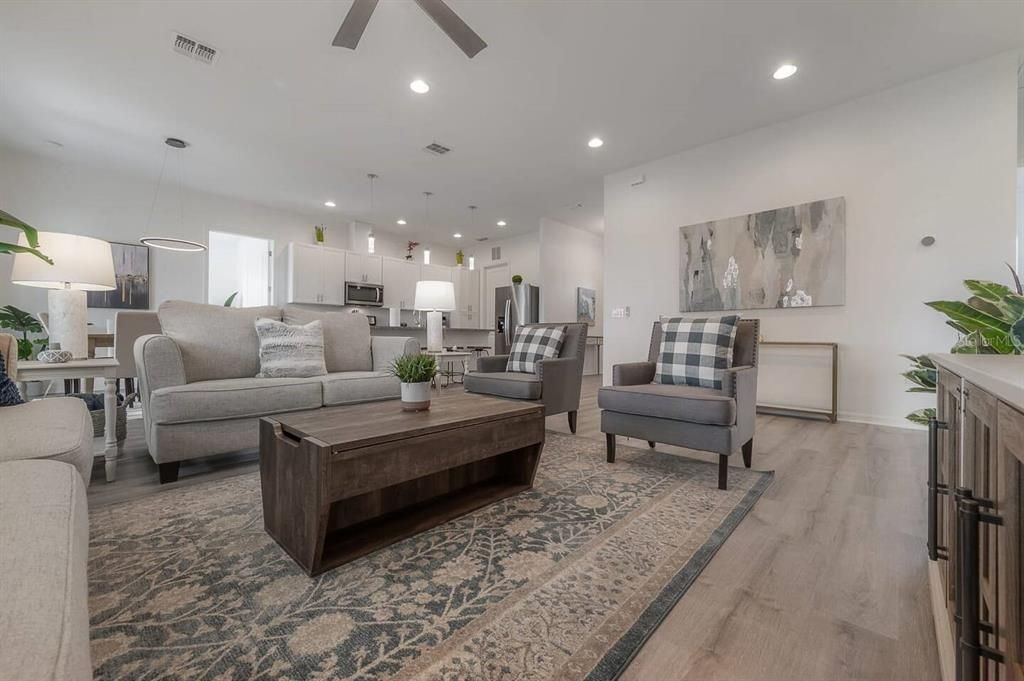 Living Area with Modern design with vaulted ceilings and open floorplan.